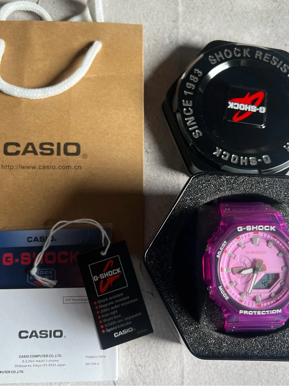 Casio G-Shock Translucent Pink Resin Watch with Black Tin